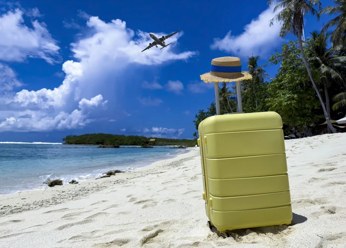 suitcase on a caribbean beach