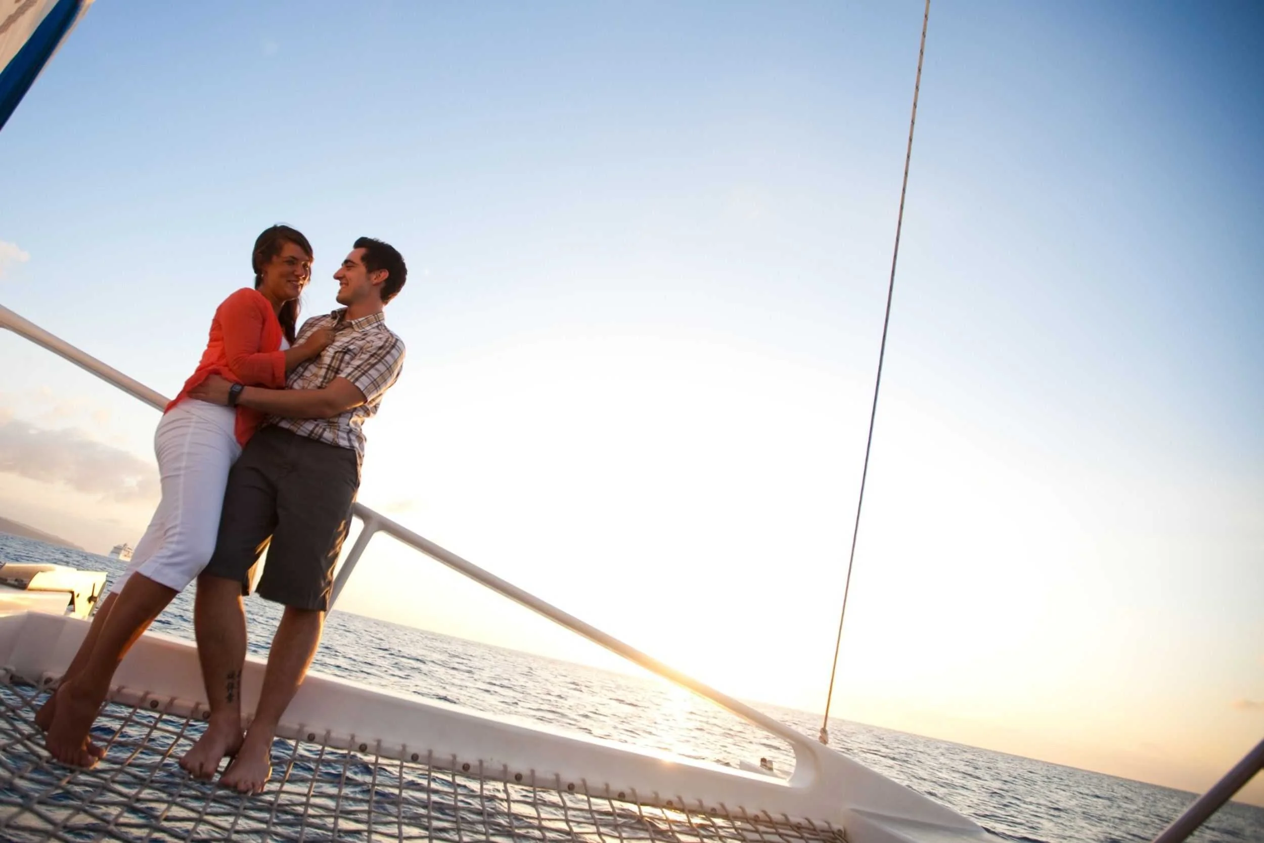 Guests relaxing together aboard a catamaran during an Antigua sailing experience