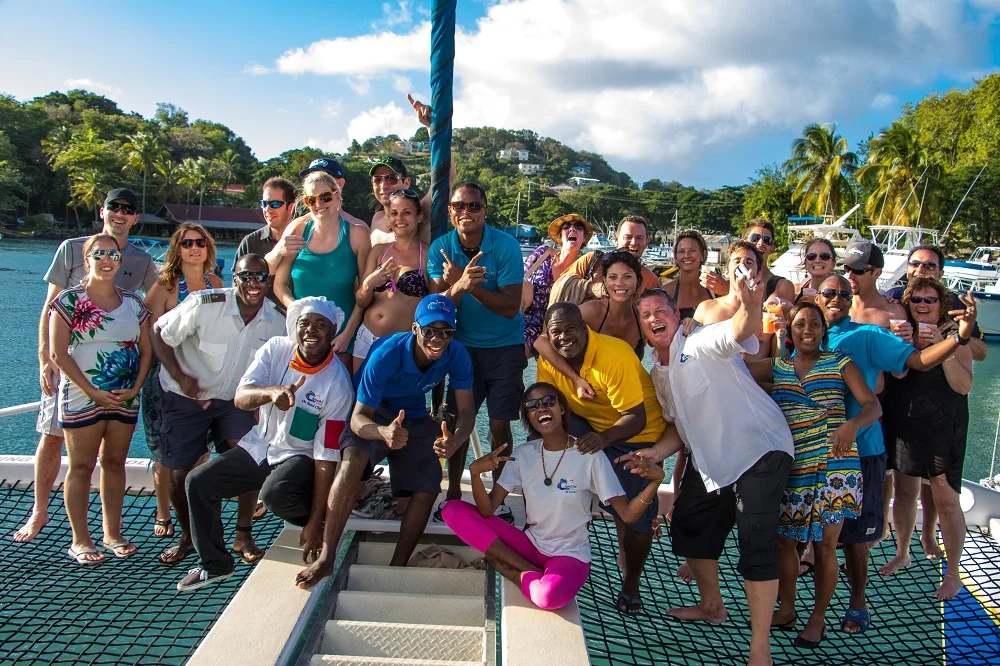 Guests and catamaran St. Lucia catamaran cruise operators taking a group photo