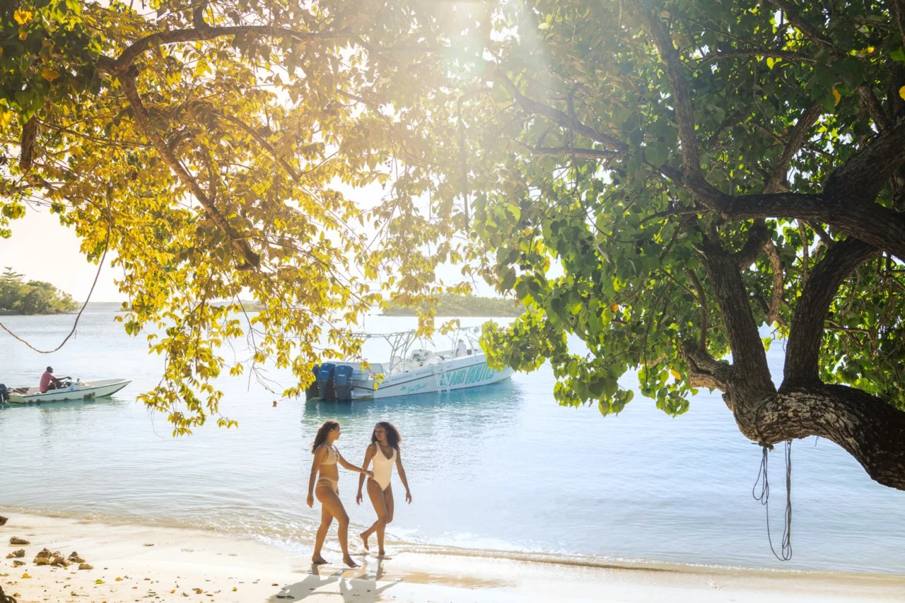 Traveler enjoying a tropical Caribbean beach after preparing for an active vacation
