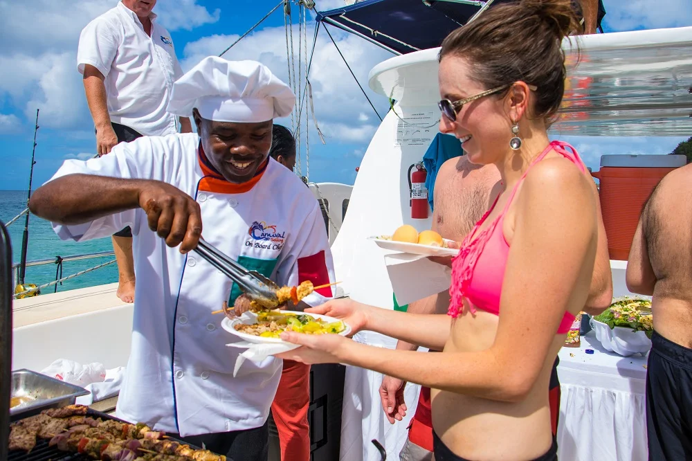 Catamaran operator giving food to guests